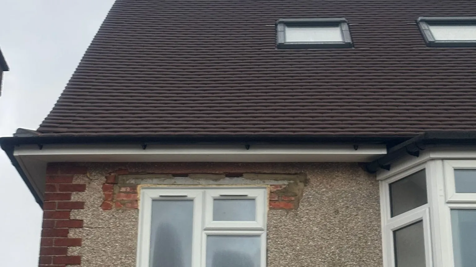 A completed re-roof and tile-hung dormer by Masters Roofing on a semi-detached house