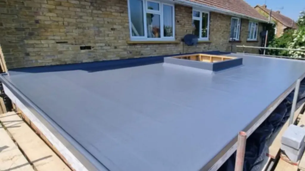 A completed GRP fibreglass flat roof by Masters Roofing with a rooflight kerb formed into the deck