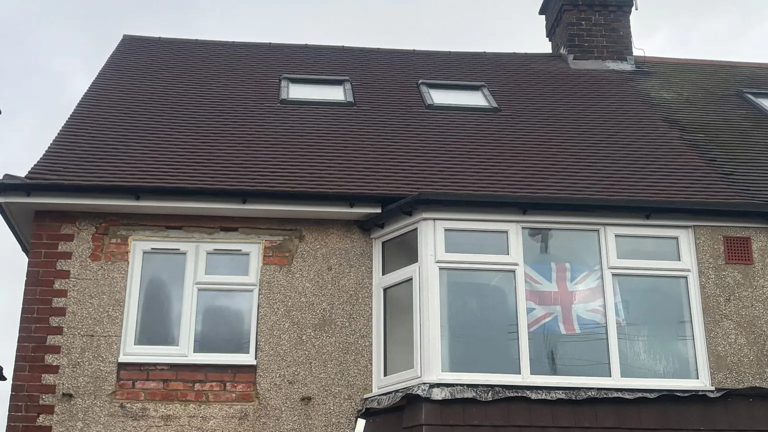 A completed re-roof and dormer extension by Masters Roofing on a semi-detached house in Worthing