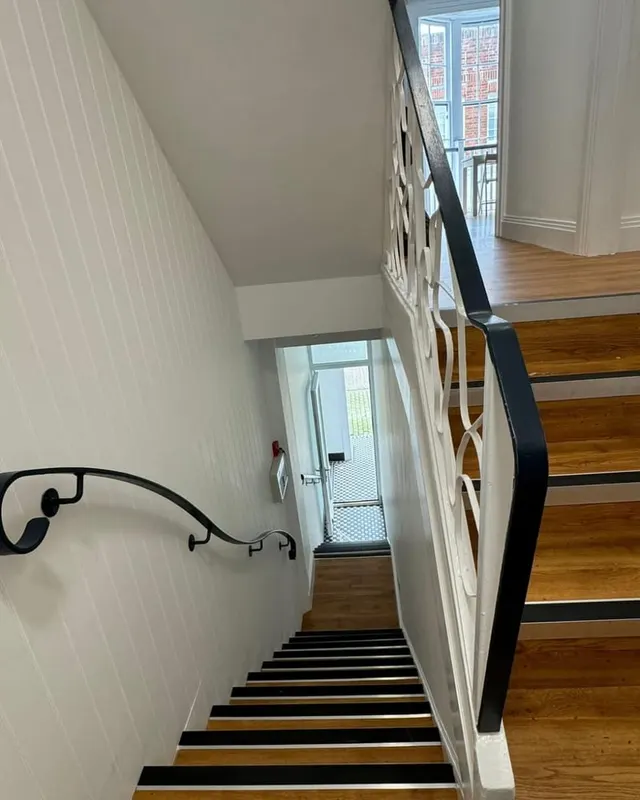 A rebuilt staircase in a converted property, with new treads, balustrade and handrail