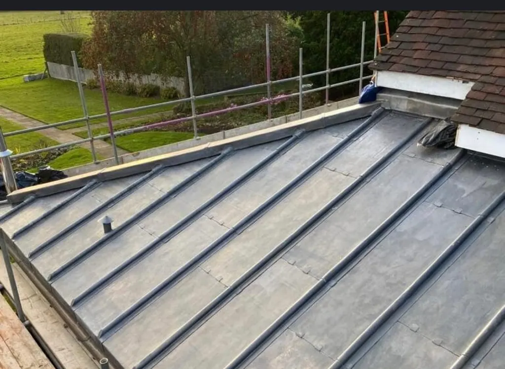 A new lead valley run between two roof slopes and dressed into the tiling on both sides