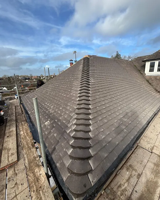 The finished re-roof, with new tiling run around the dormer and up to the ridge