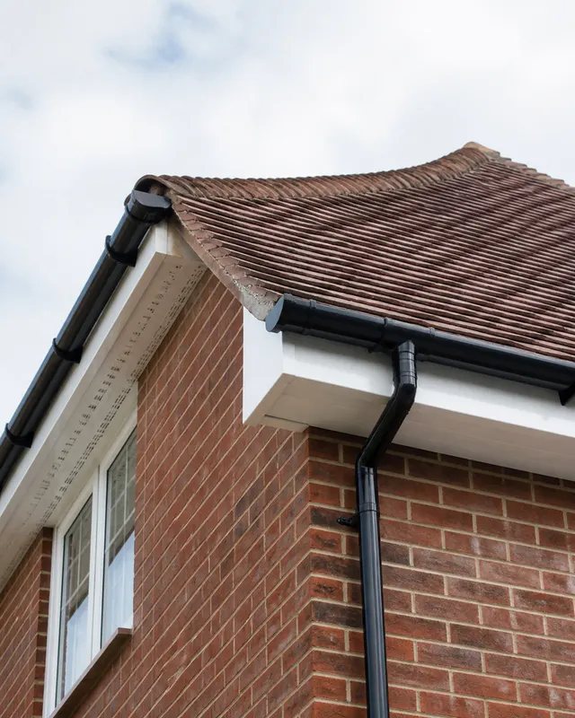 Replacement white UPVC fascias, soffits and guttering fitted across the front elevation of a house in BN13