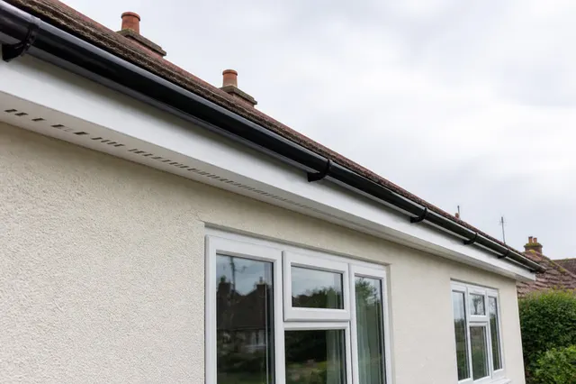 Newly fitted fascias and vented soffits along the eaves of a bungalow in BN16