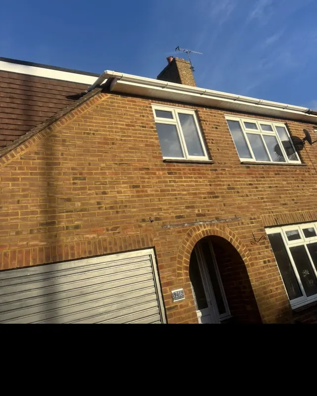 Replacement white UPVC fascias, soffits and guttering fitted across the front elevation of a semi-detached house